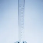 Merck Pyrex Measuring cylinder with spout, class A with white graduations