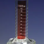 Merck Pyrex Lifetime Red single metric scale graduated cylinder, with double pourout